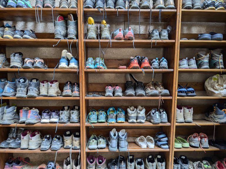 Hiking shoes in a pilgrims hostel on the Via Podiensis
